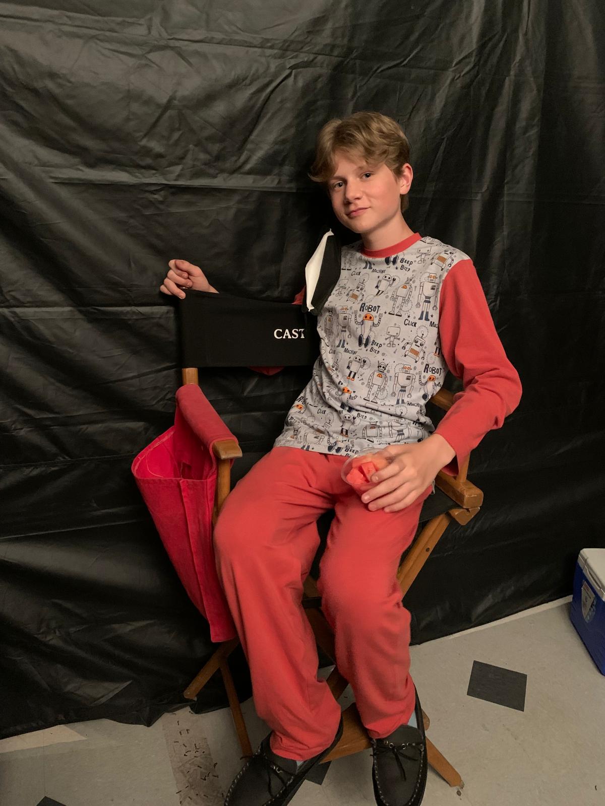Waiting in a cast chair between takes