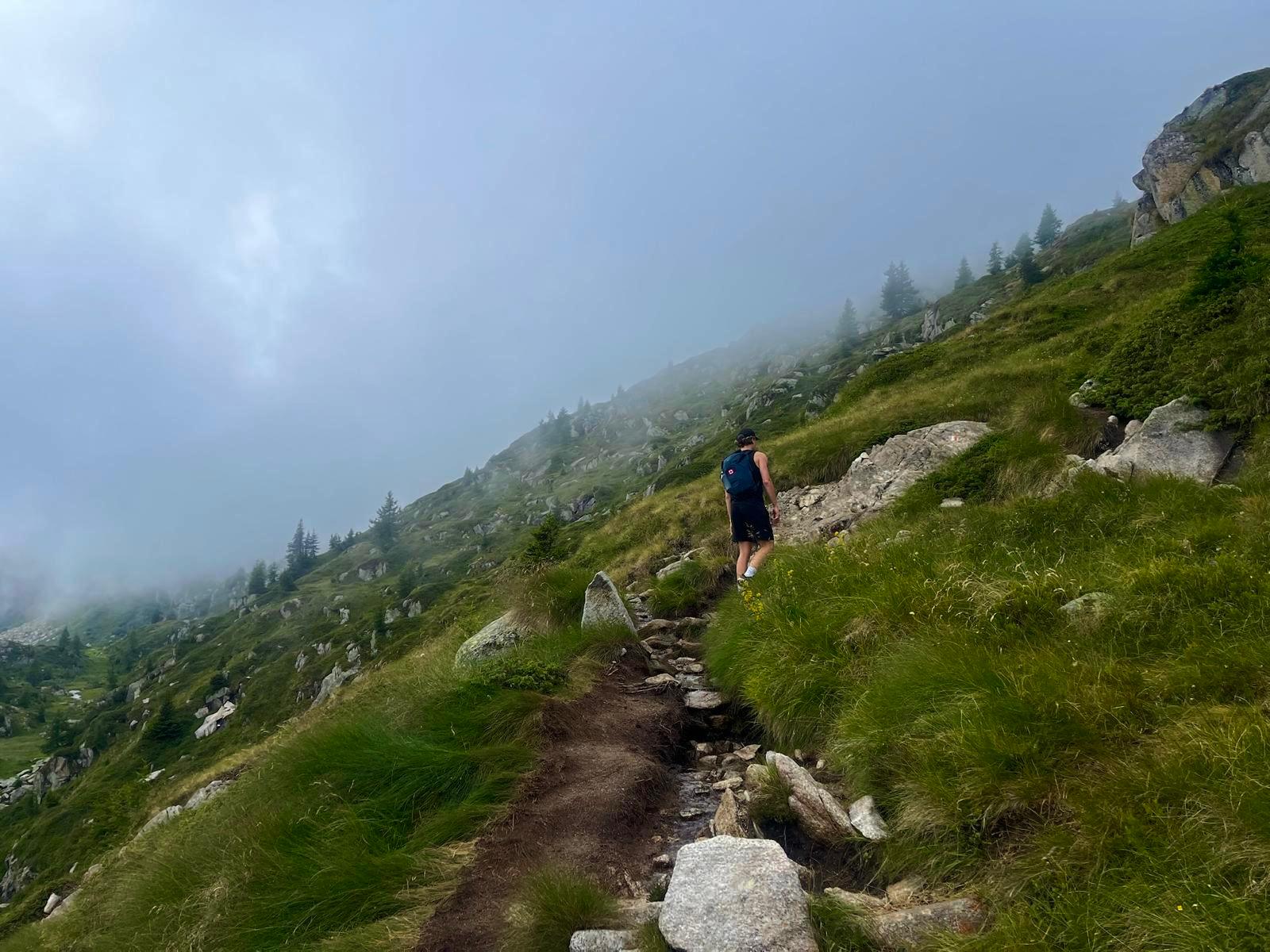 Hiking a misty alpine trail in the Dolomites
