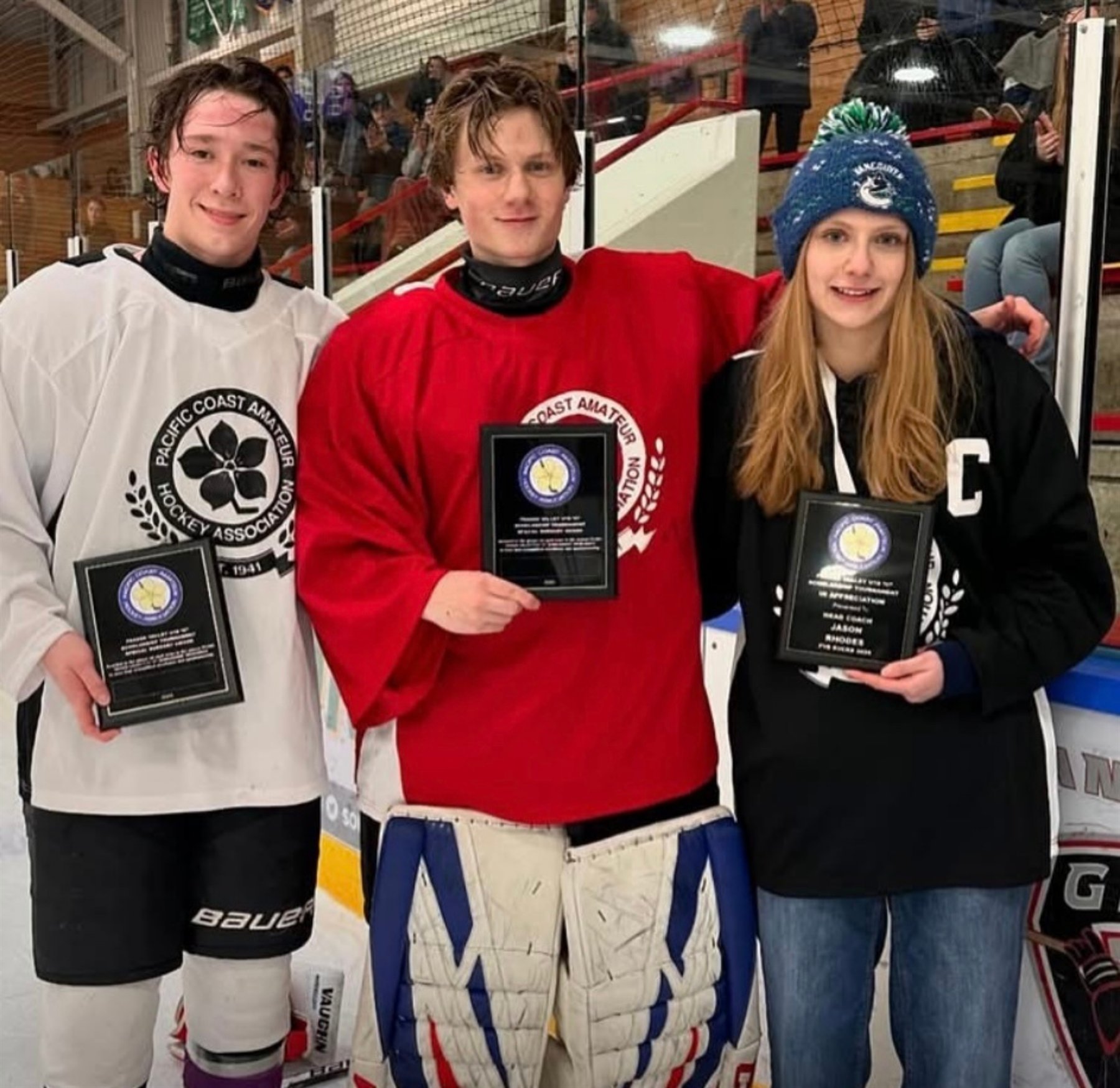 PCAHA scholarship award presentation on the ice