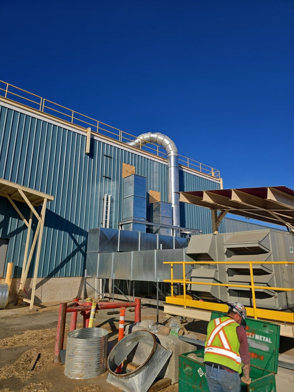 The relocated unit at grade beside the building